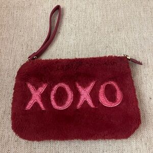 Red furry xoxo clutch wristlet